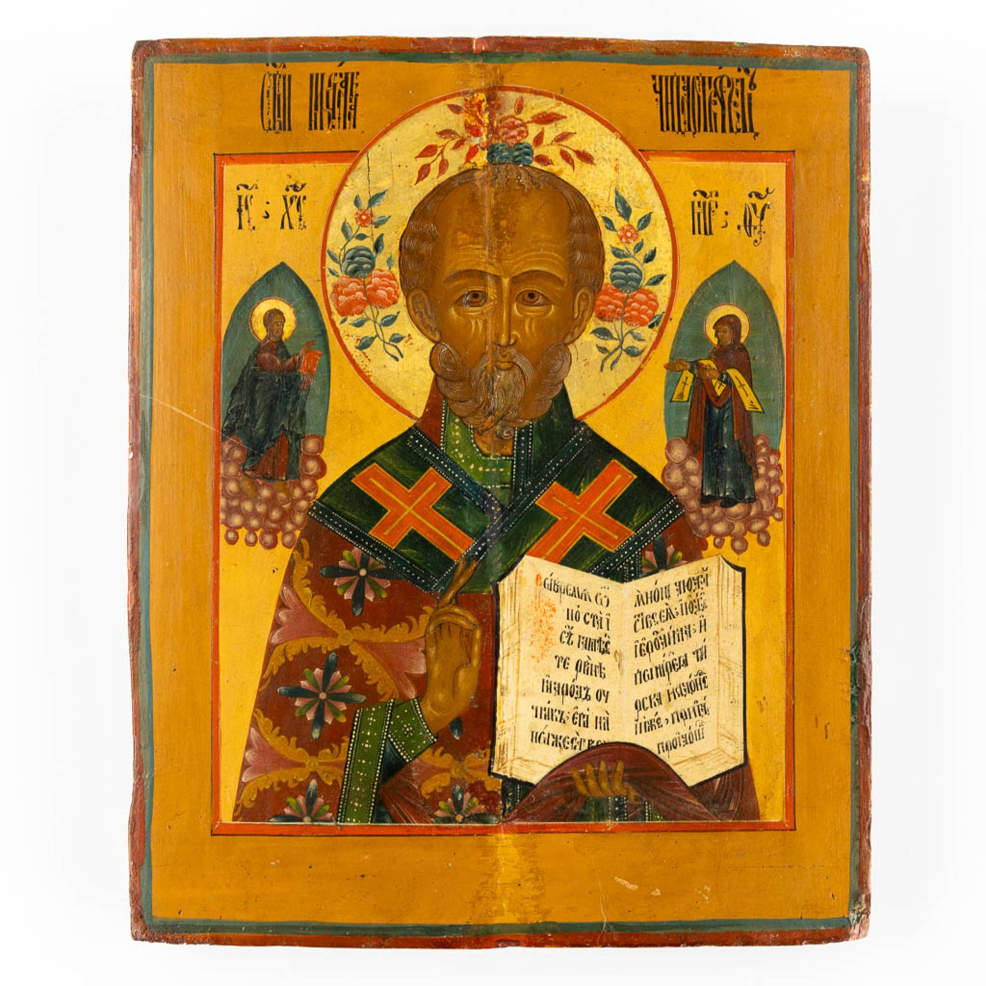 An antique Eastern European Icon 'Nicholas of Myra', tempera on panel. 18th/19th C. (W:25 x H:31 cm)