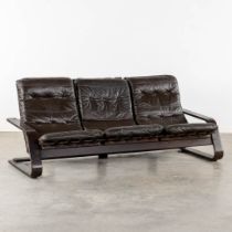A three-person sofa, wood and leather. In the style of Westnova. (L:85 x W:192 x H:85 cm)