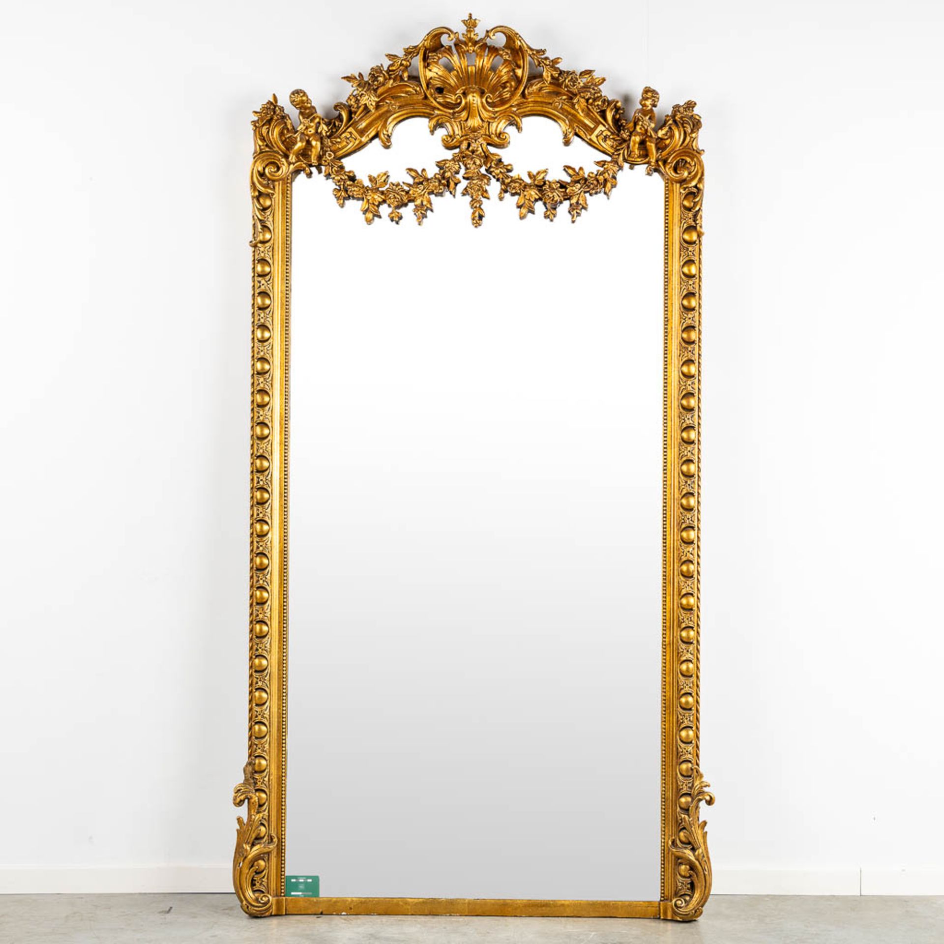 A mirror, sculptured wood, and stucco in a Louis XV style. 20th C. (W:110 x H:218 cm) - Image 2 of 13