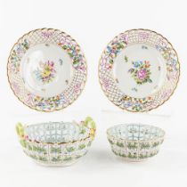 Herend, two ajoured plates and baskets with a hand-painted decor, polychrome porcelain. (D:24 cm)