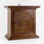 A small wall-mounted tabernacle, sculptured wood with an IHS logo. 18th/19th C. (L:23 x W:45 x H:44
