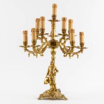 A large and decorative table lamp with a musketeer figurine, gilt bronze. 20th C. (H:61 x D:46 cm)