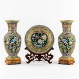 A three-piece mantle garniture, openworked cloisonné enamel. Two vases and a plate. (H:39 x D:16,5 c