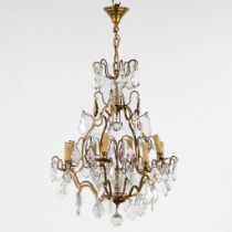 An antique chandelier, brass with coloured and white glass. Circa 1930. (H:80 x D:68 cm)