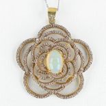 A necklace with pendant, gilt silver with a Caobochon Opal and old cut diamonds, on a 14-kt white go