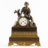 A mantle clock, gilt and patinated bronze, Empire style. 19th C. (L:13 x W:34 x H:46 cm)
