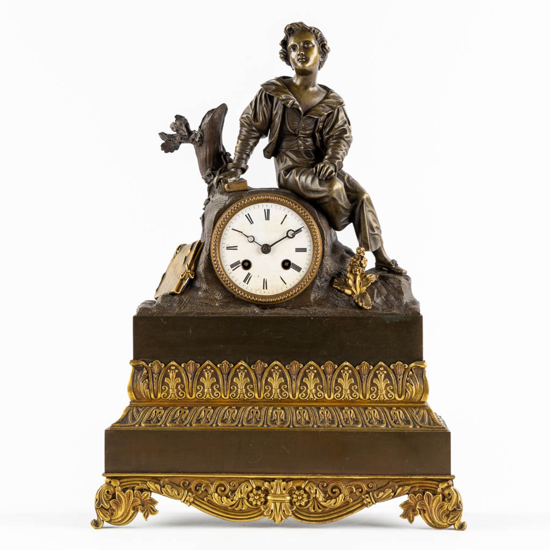 A mantle clock, gilt and patinated bronze, Empire style. 19th C. (L:13 x W:34 x H:46 cm)