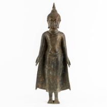 A Thai figurine of a standing Buddha, Patinated bronze. (W:16 x H:44 cm)