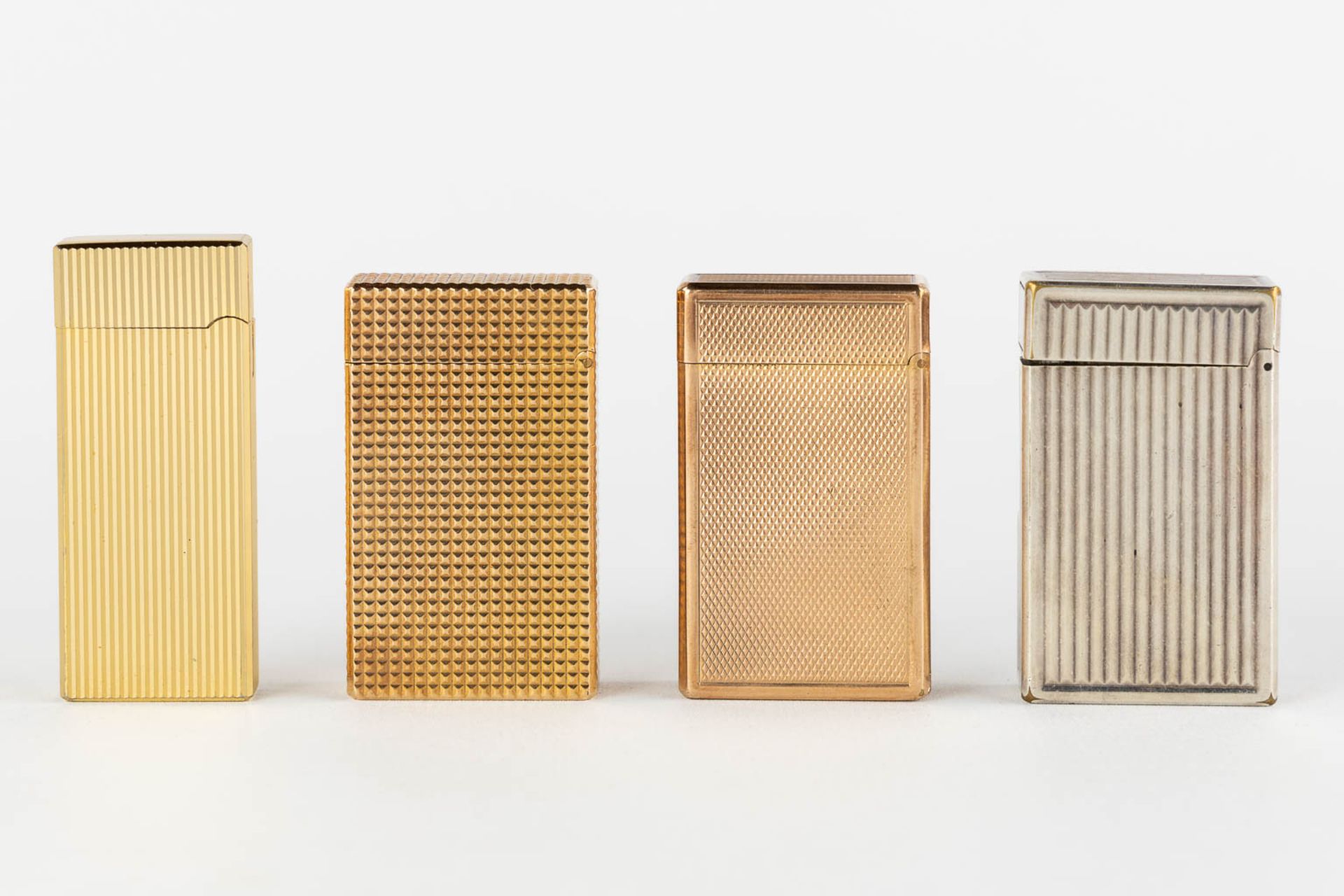 ST. Dupont, Three gold and silver plated lighters, added a Givency lighter. (L:1 x W:3,5 x H:6 cm) - Bild 9 aus 14