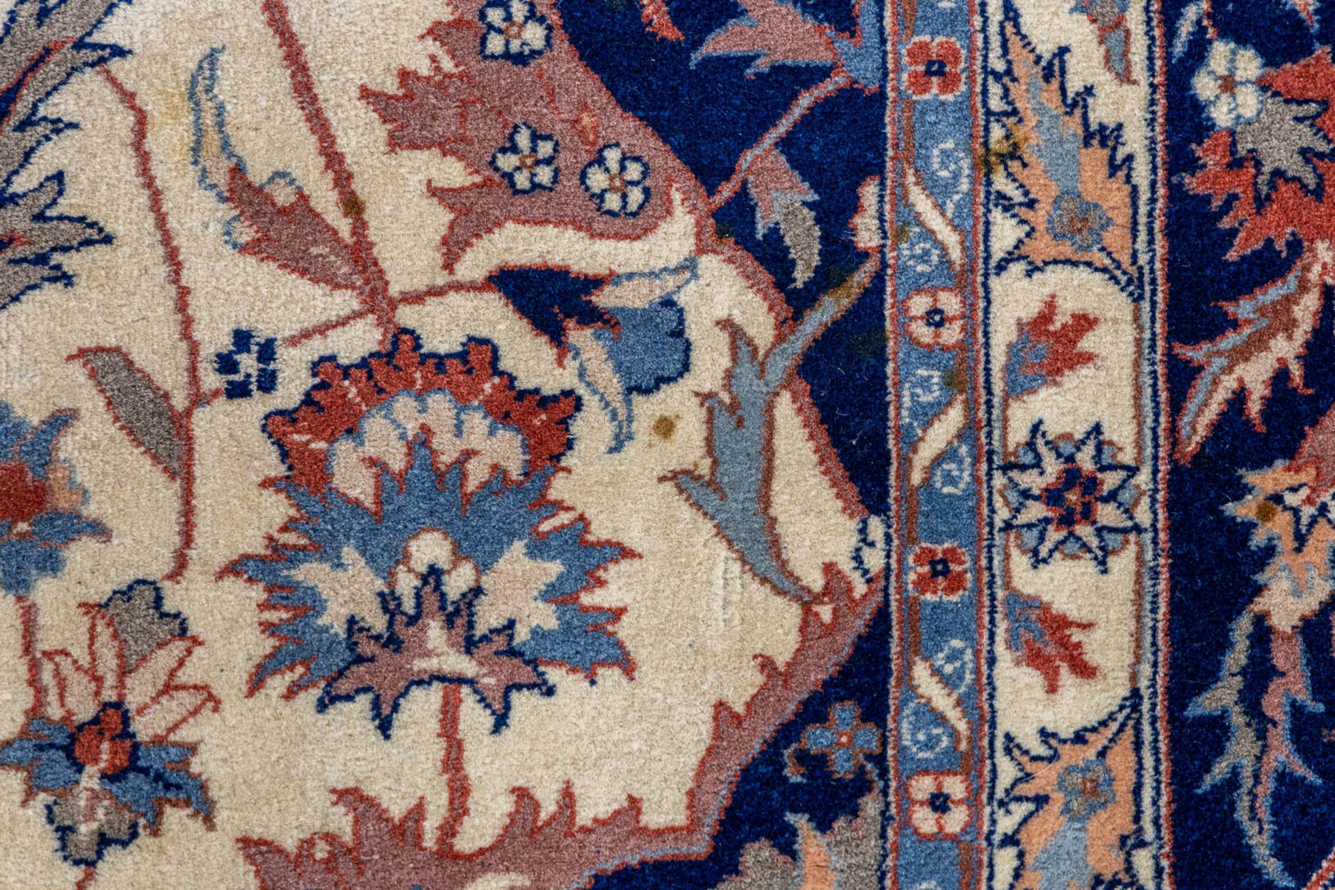 An Oriental hand-made carpet, Isfahan. (L:312 x W:250 cm) - Image 7 of 9