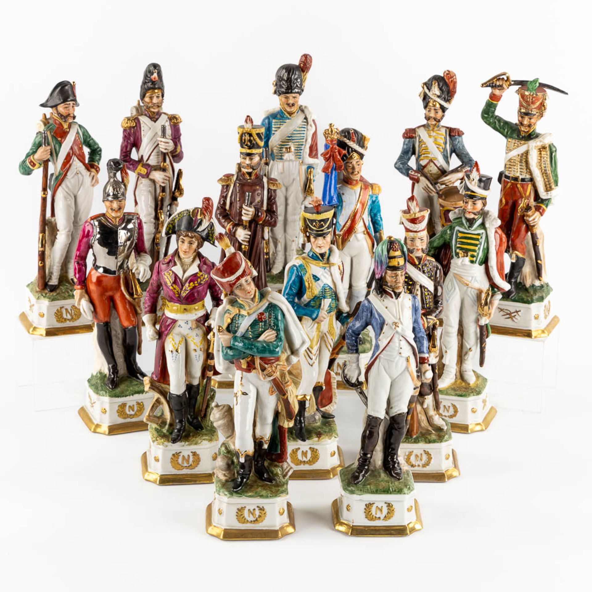 Napoleon Bonaparte and the generals, 14 figurines. Polychrome porcelain. (H:32 cm)