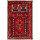 An Oriental hand-made carpet, Bellutch, Prayer rug. (L:130 x W:83 cm)