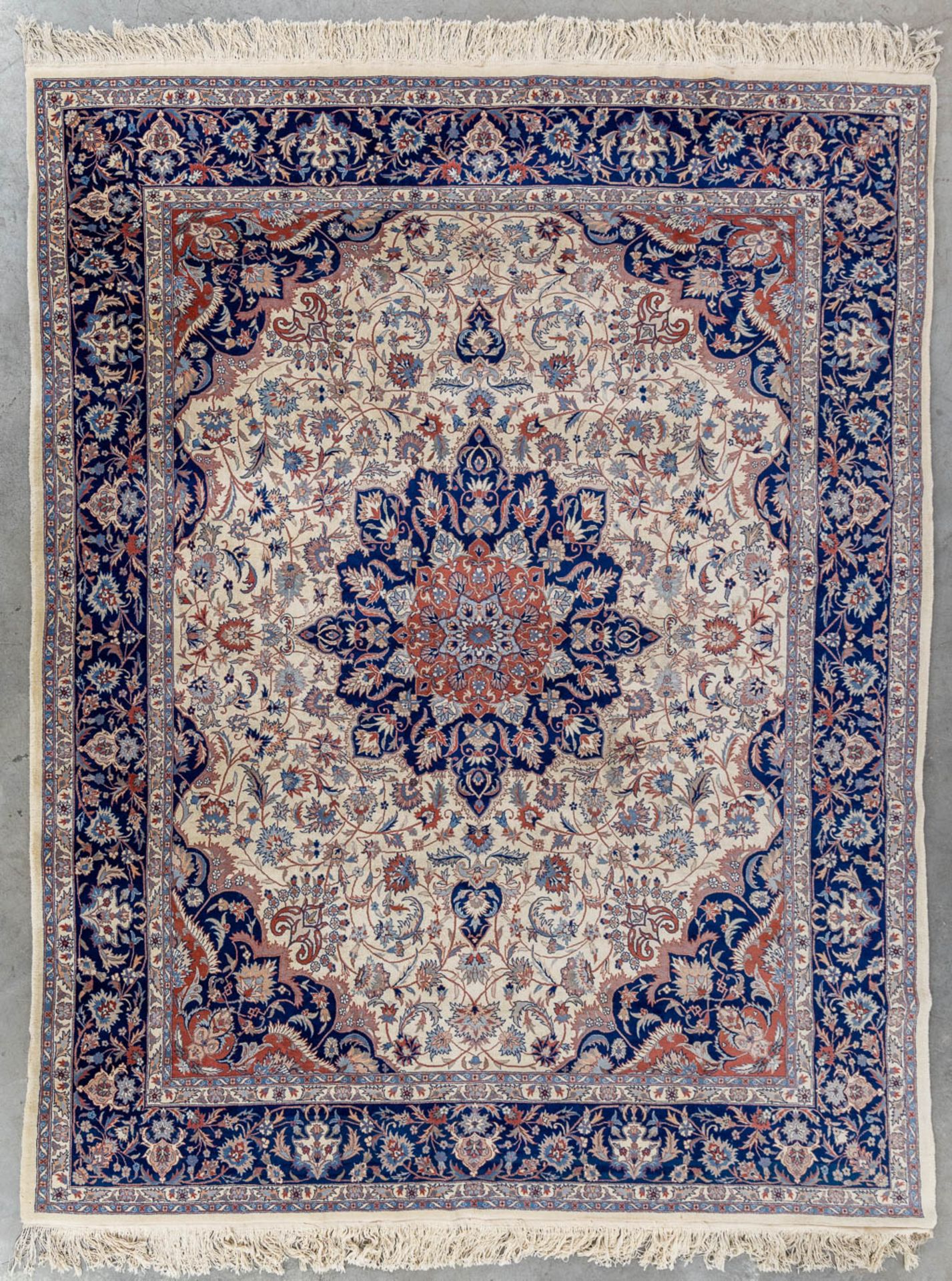 An Oriental hand-made carpet, Isfahan. (L:312 x W:250 cm)