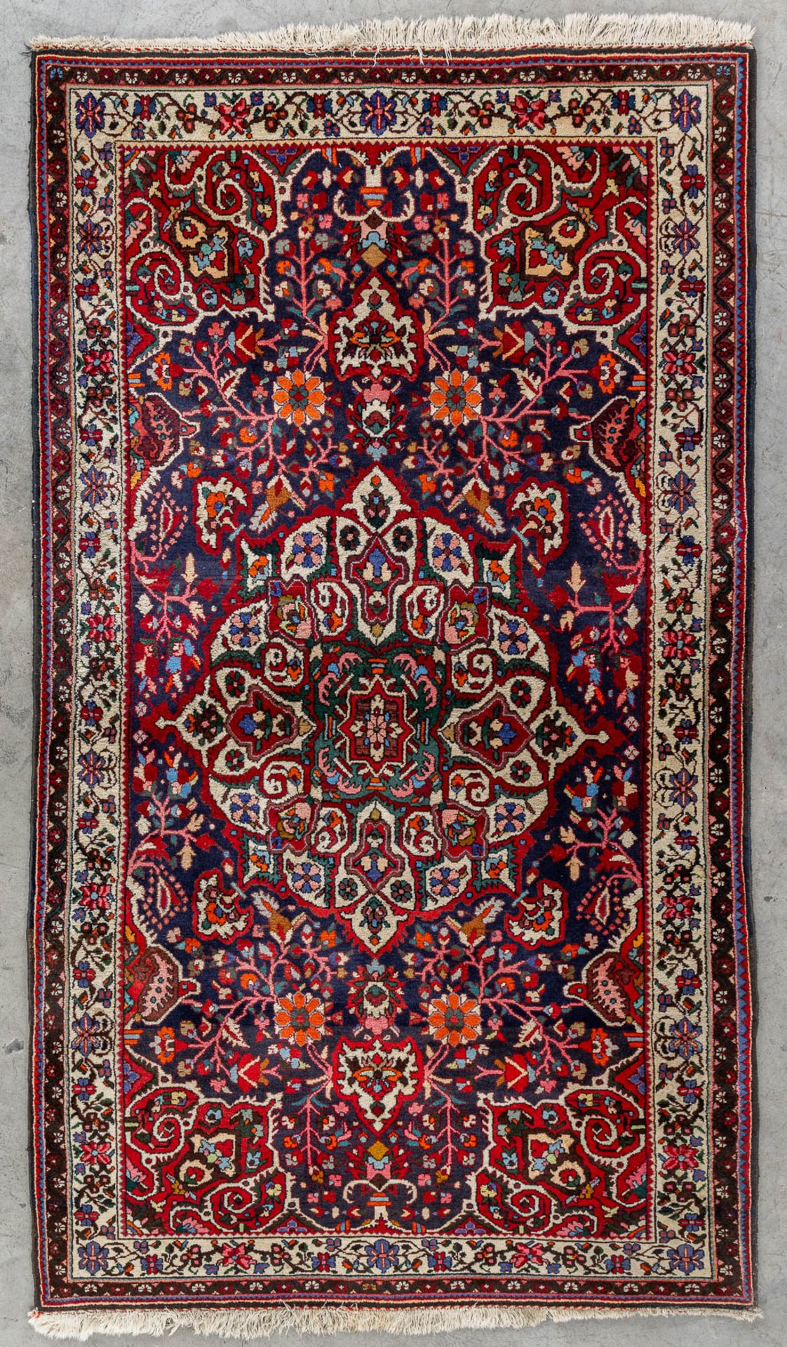 An Oriental hand-made carpet, Bakthiari. (L:237 x W:135 cm)