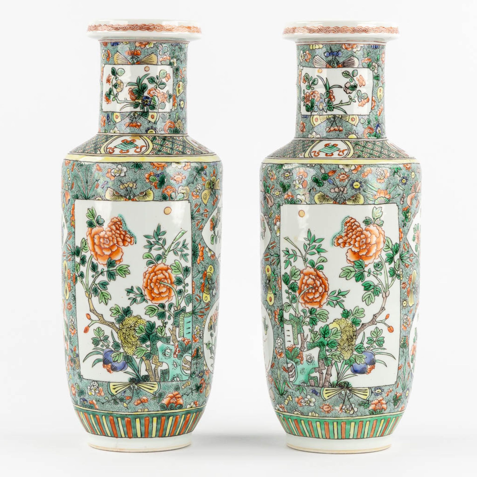 A pair of Chinese Famille Verte vases, decorated with flowers and symbols of happiness. 19th/20th C.