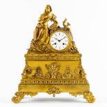 A mantle clock, gilt bronze depicting a reading lady. Louis Philippe, 19th C. (L:15 x W:38 x H:45 cm