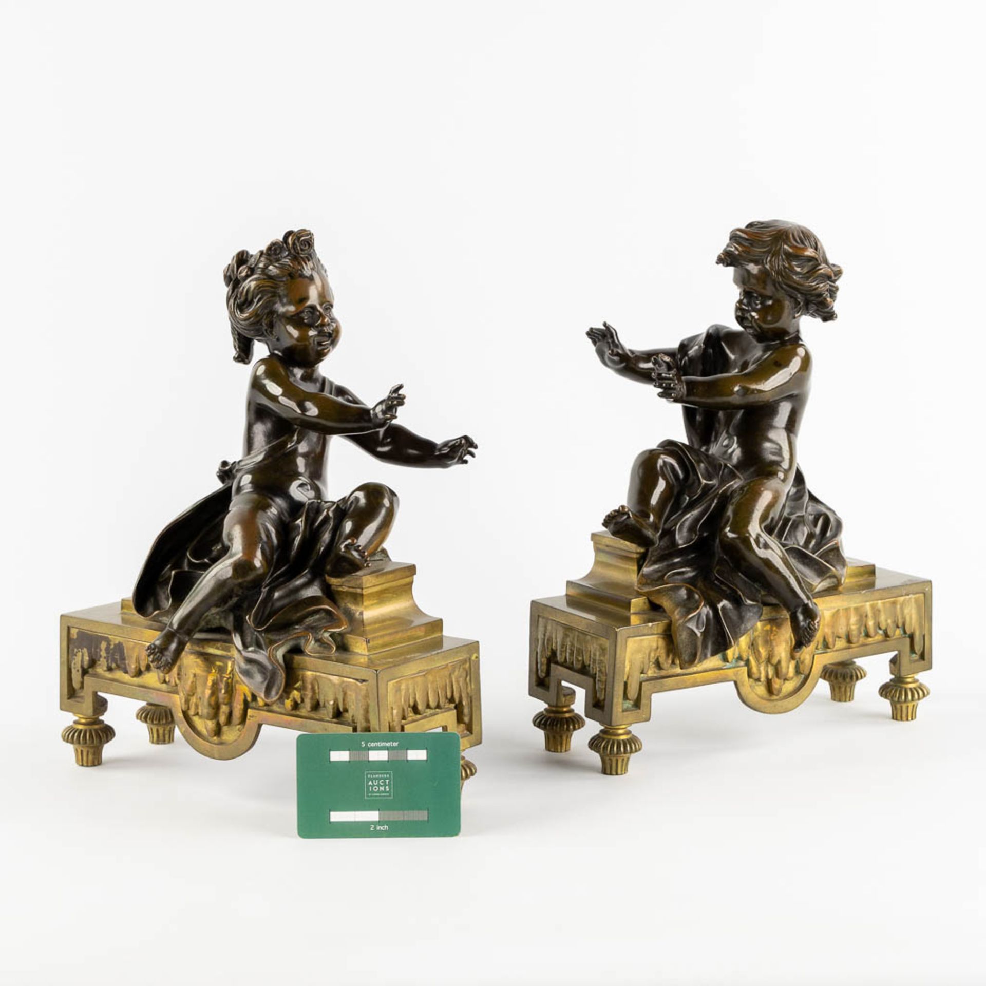 A pair of fireplace bucks, gilt and patinated bronze with boy and girl, 19th C. (L:13 x W:24 x H:31 - Image 2 of 10