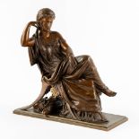 Lady seated in a lounge chair, Neoclassical. Patinated bronze. (L:16 x W:35 x H:36 cm)