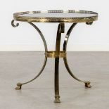 A mid-century side table, gilt metal with a tinted glass top. (H:57 x D:64 cm)