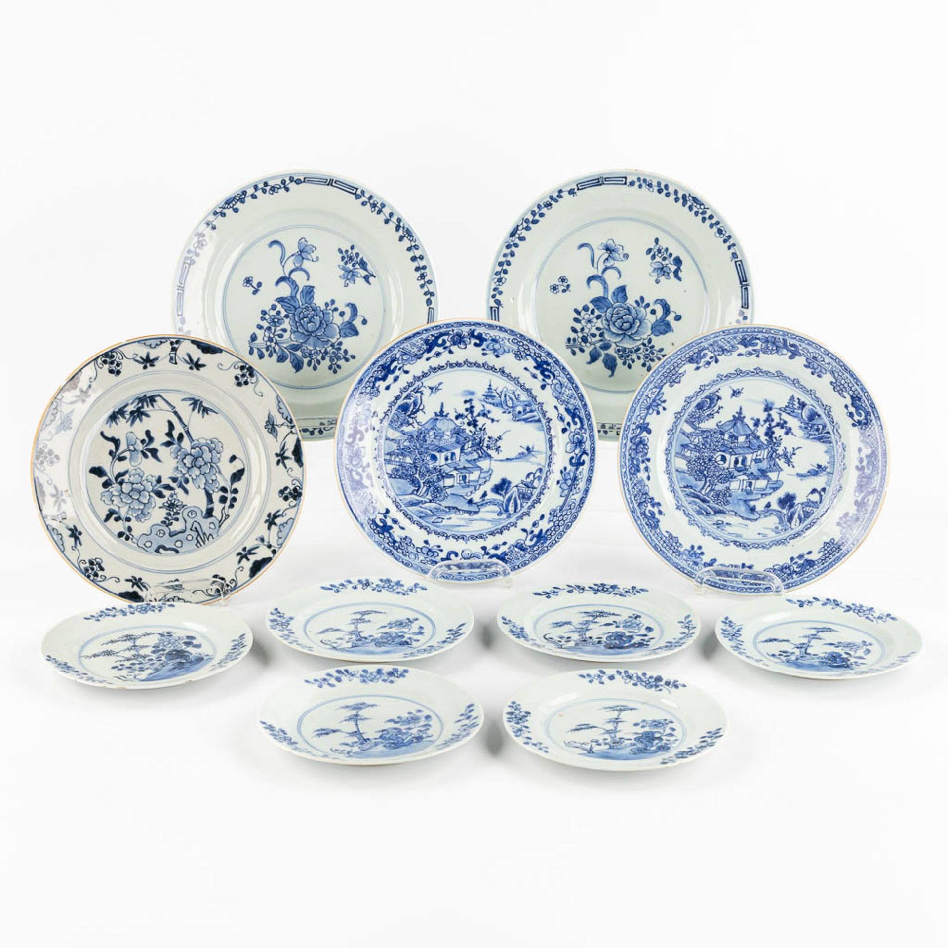 Eleven pieces of Chinese porcelain plates, blue-white decor. (D:24 cm)