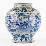 A large Chinese vase, blue-white decorated with fauna and flora. (H:35 x D:32 cm)