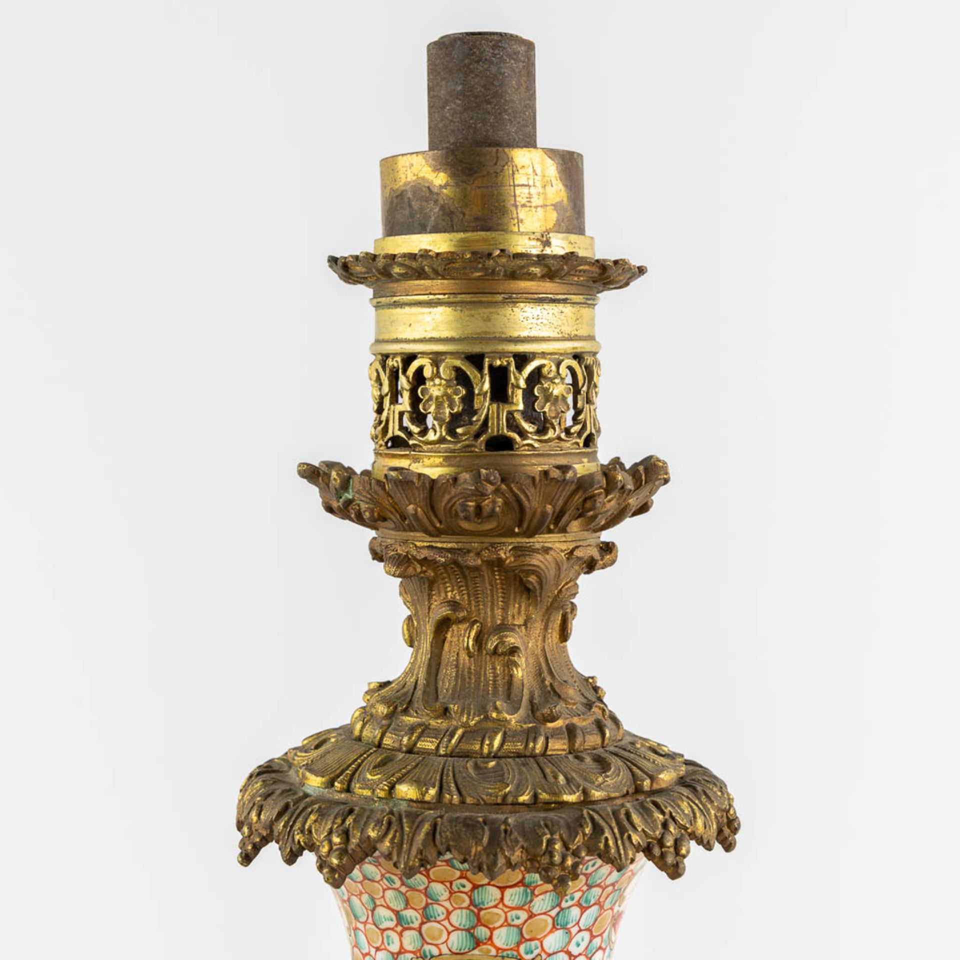 An antique oil lamp, Chinese Famille Rose porcelain mounted with gilt bronze. 19th C. (L:20 x W:20 x - Image 7 of 12