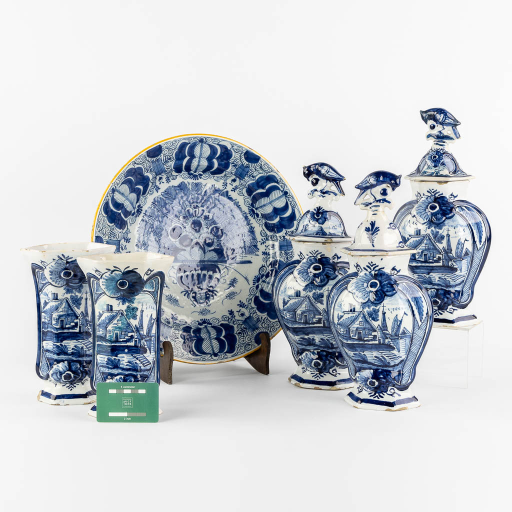 Delft, 'De Drie Klokken' A 5-piece 'Kaststel', added a 'De Porceleyne Klaauw' Peacock plate. 18th. ( - Image 19 of 26