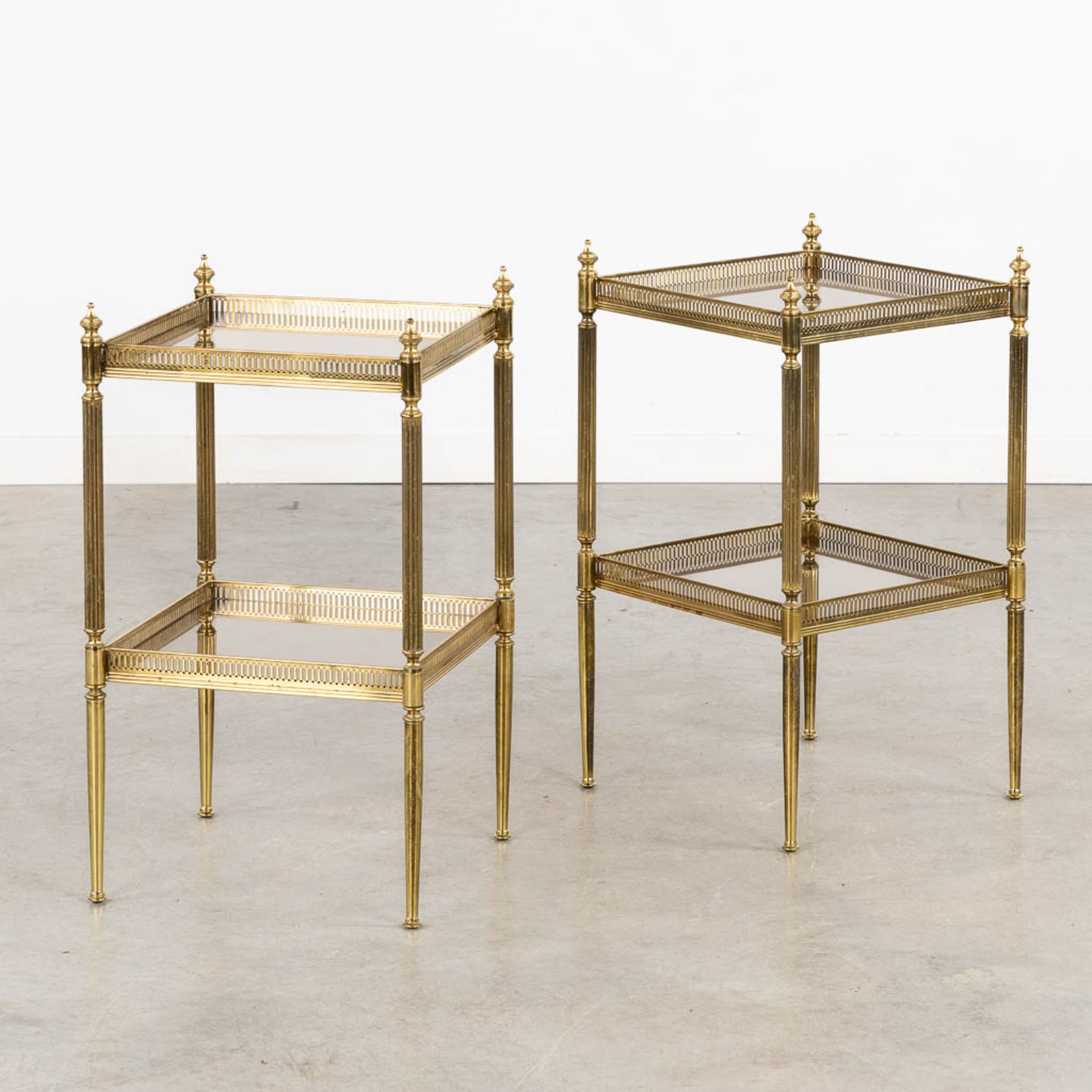 A pair of two-tier side tables in the style of Maison Jansen. (L:34 x W:34 x H:59 cm)