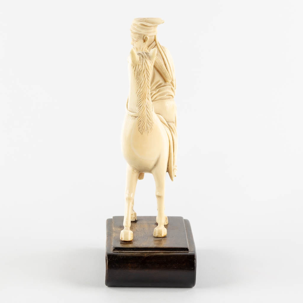 A Chinese sculptured figurine of Zhang Guolao, one of the eight immortals, ivory. (L:6 x W:12 x H:20 - Image 4 of 10