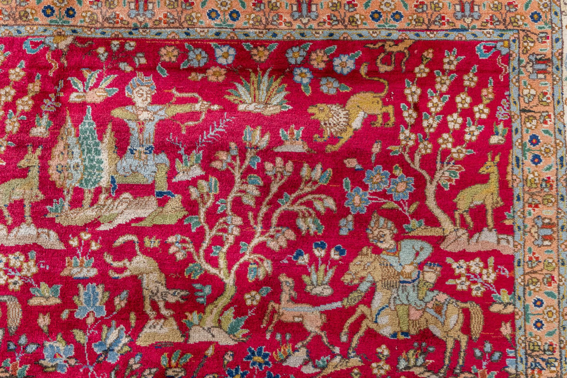 A large Oriental hand made carpet, hunting scènes, Tabriz. (L:329 x W:252 cm) - Image 10 of 16