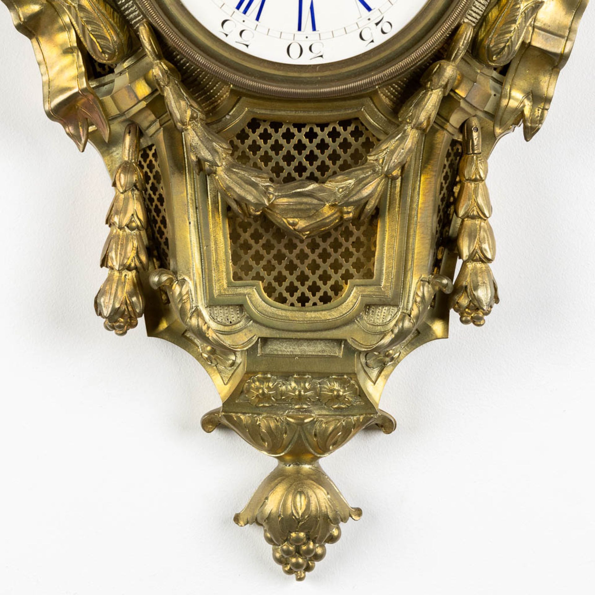 A wall-mounted bronze cartel clock, Louis XVI style. 19th C. (L:12 x W:37 x H:71 cm) - Image 5 of 7