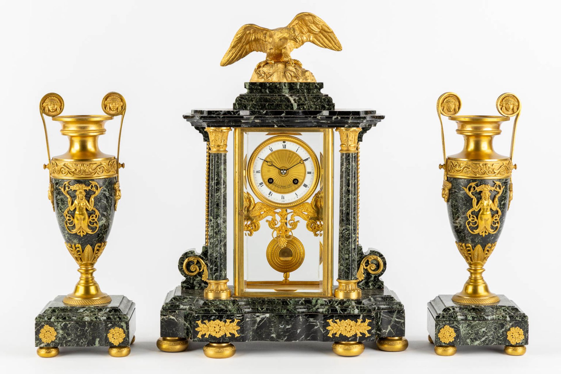 A three-piece mantle garniture clock and urns, gilt bronze on green marble, Empire style. France, 19 - Image 3 of 14