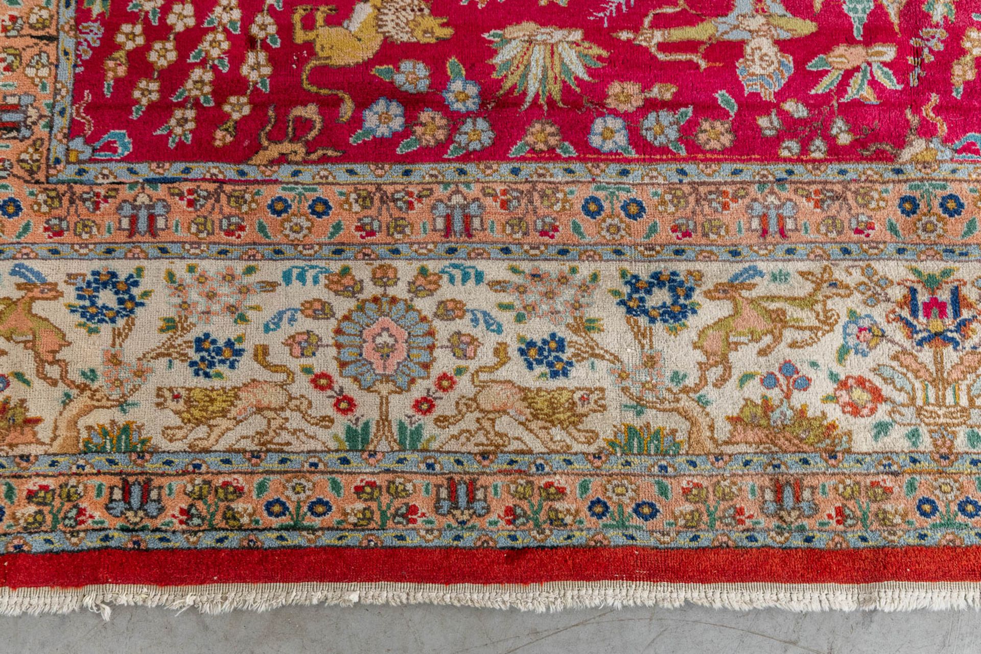 A large Oriental hand made carpet, hunting scènes, Tabriz. (L:329 x W:252 cm) - Image 13 of 16