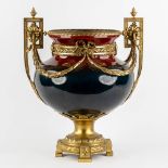 A large faience vase mounted with gilt bronze in Louis XV style. Circa 1900. (L:34 x W:40 x H:50 cm)