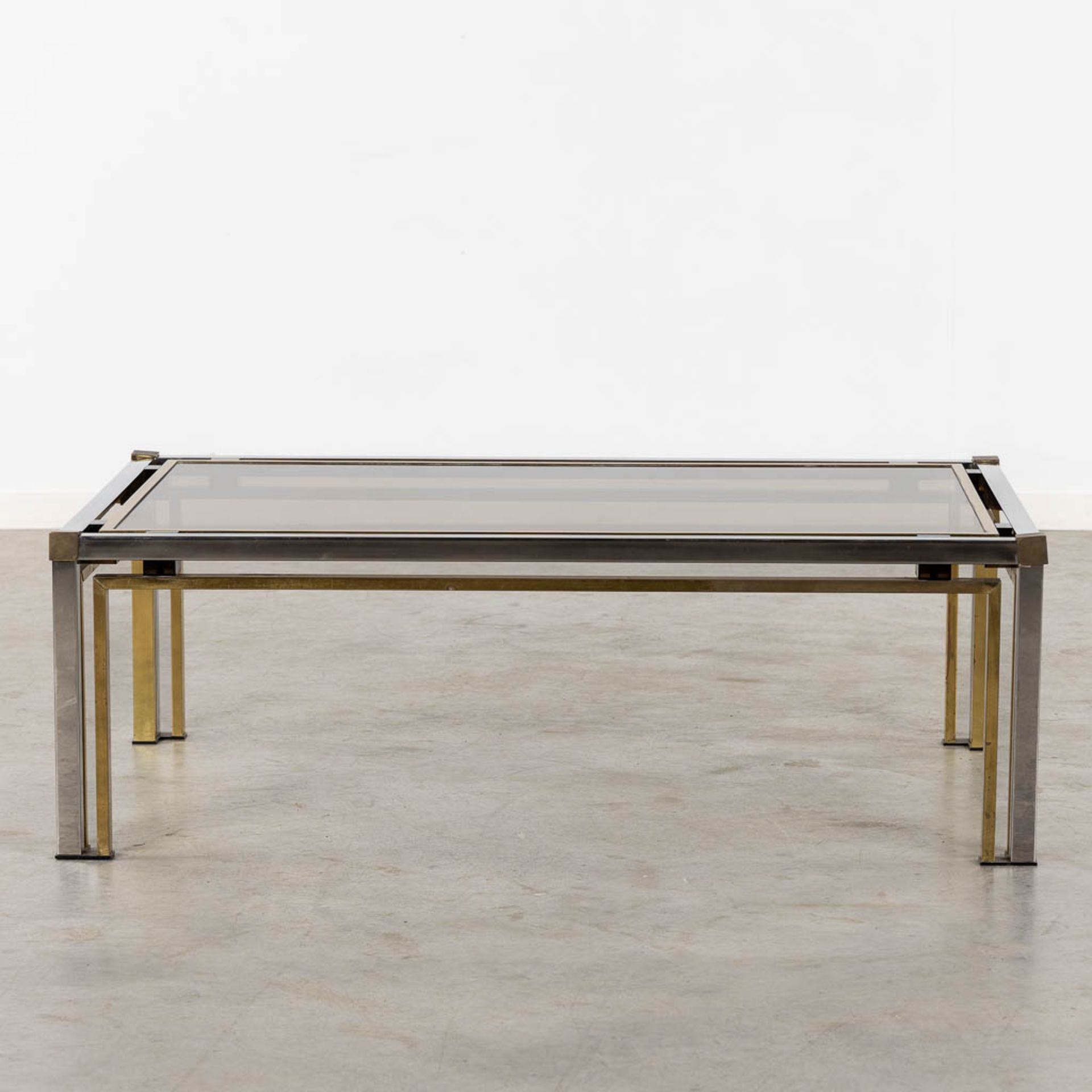 A coffee table, brass and glass. Dewulf Selection / Belgo Chrome. (L:60 x W:120 x H:50 cm)