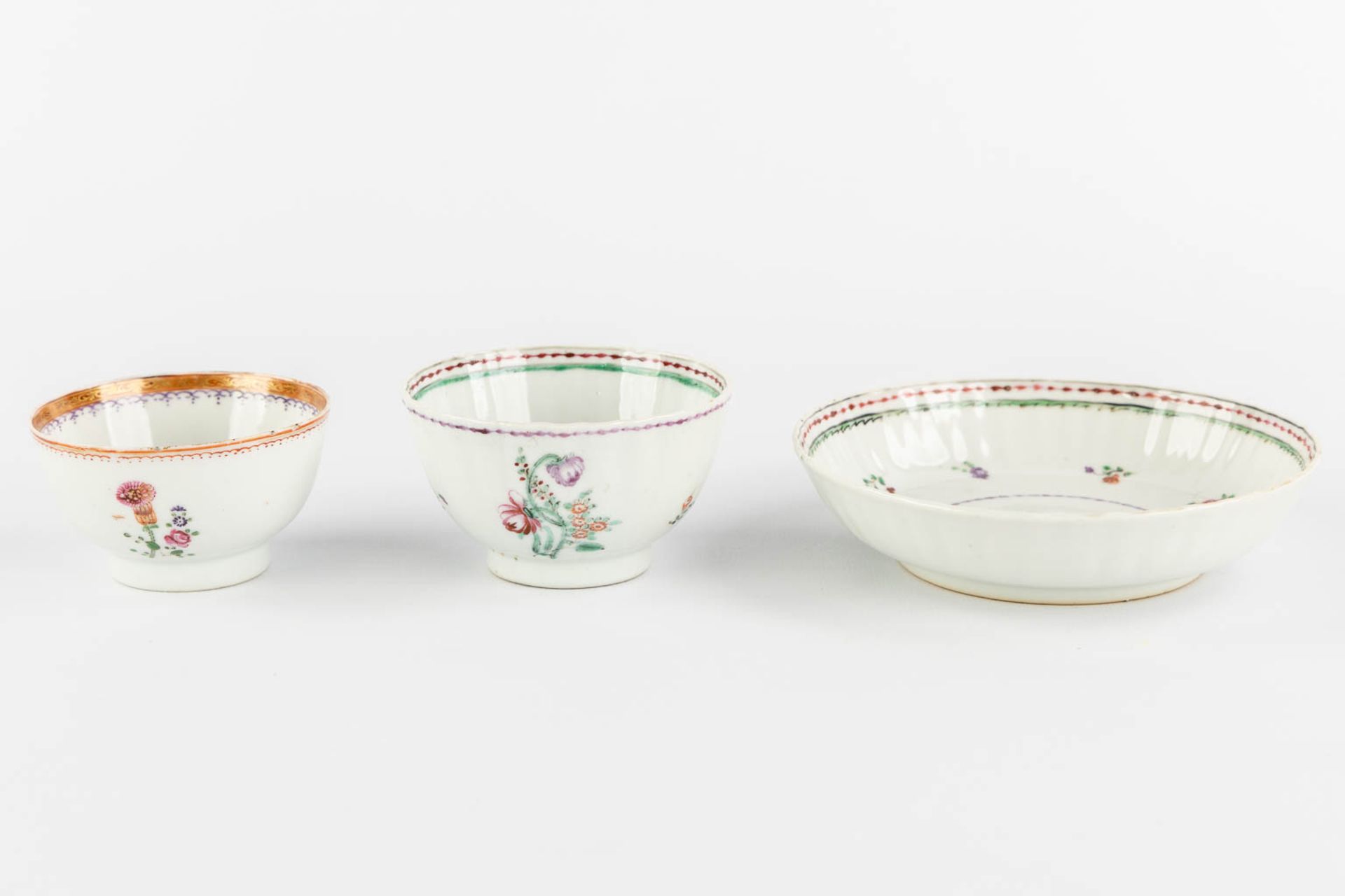 Ten Chinese Famille Rose plates and cups, flower decor. (D:23,5 cm) - Image 11 of 13