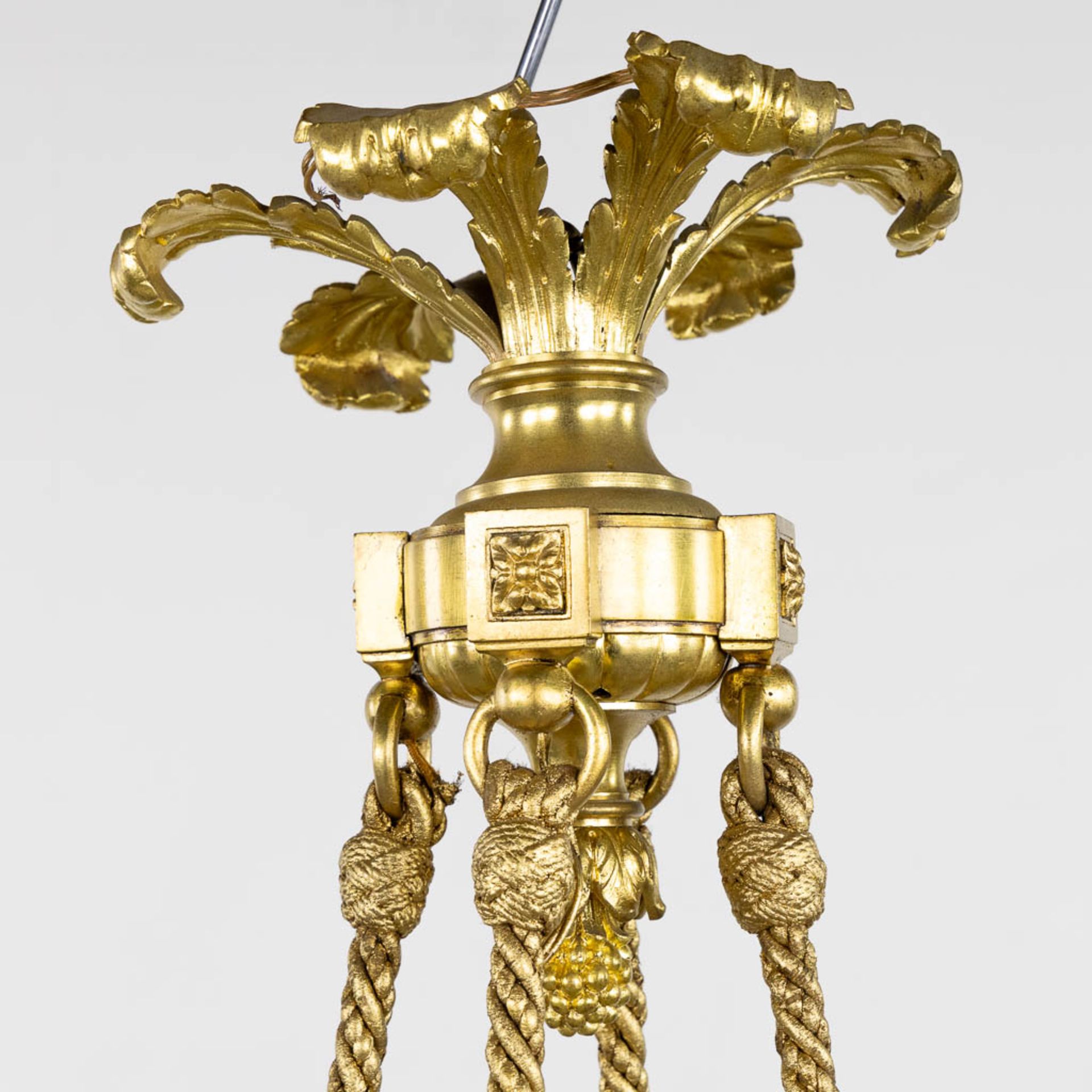 A chandelier, bronze in a Louis XVI style. Gilt bronze. (H:100 x D:72 cm) - Image 6 of 9