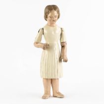 An antique patinated and wood-sculptured doll. 19th C. (L:11,5 x W:17 x H:45 cm)
