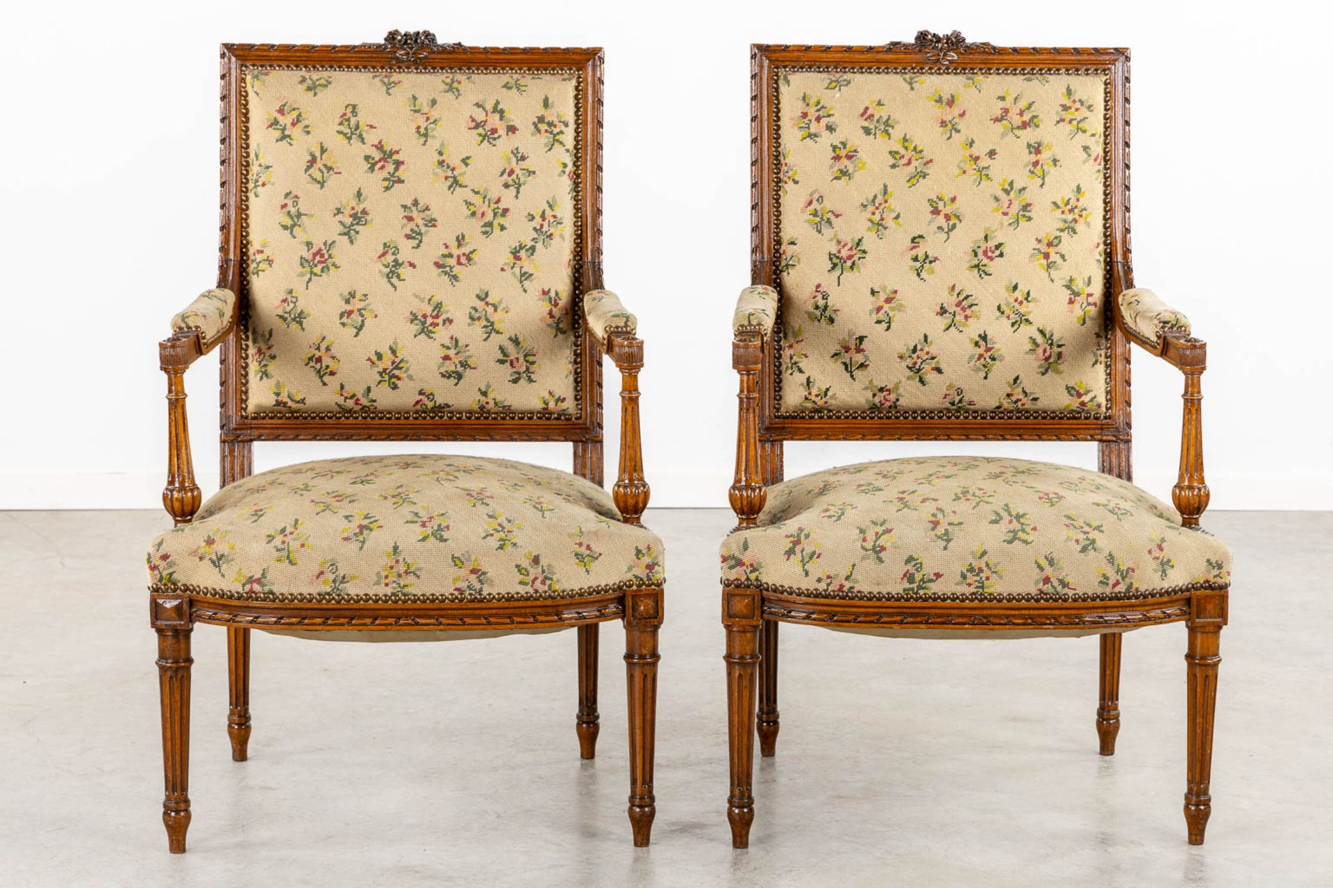A pair of wood-sculptured armchairs with emboidered upholstry. Louis XVI style. (L:62 x W:64 x H:100 - Image 3 of 11