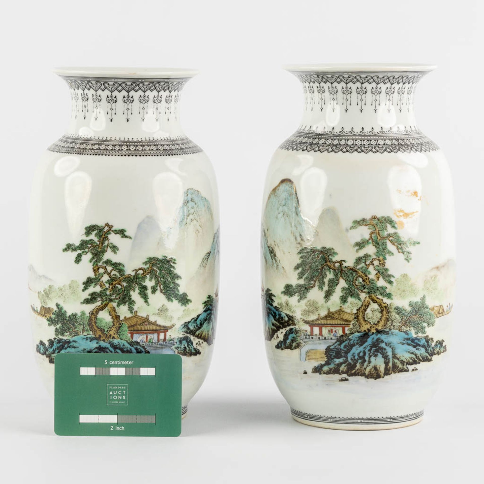 A pair of Chinese vases with a mountain landscape, 20th C. (H:24 x D:14 cm) - Image 2 of 12