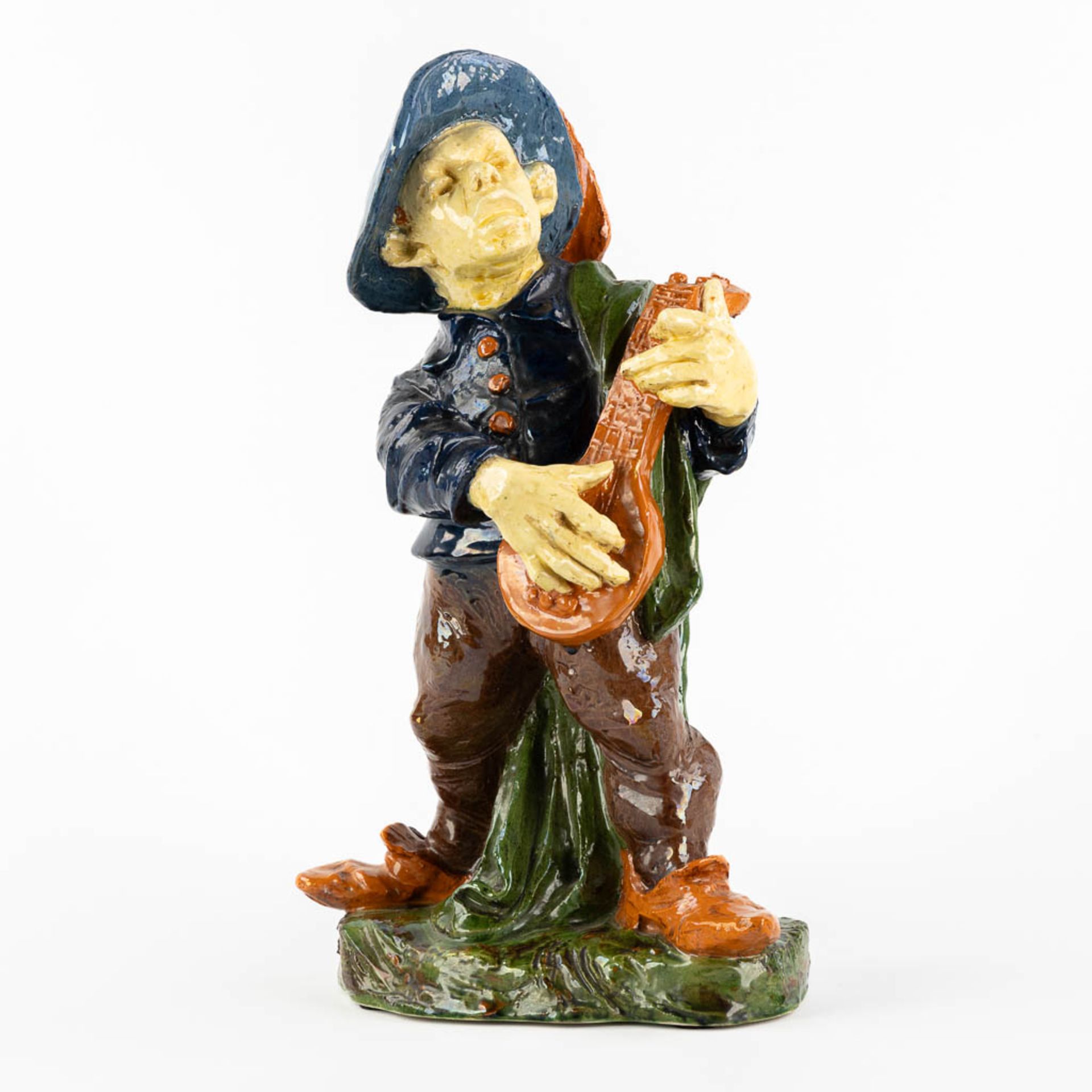 Flemish Earthenware, Caessens, A street musician. Kortrijk, Belgium. (L:14 x W:23 x H:38 cm)