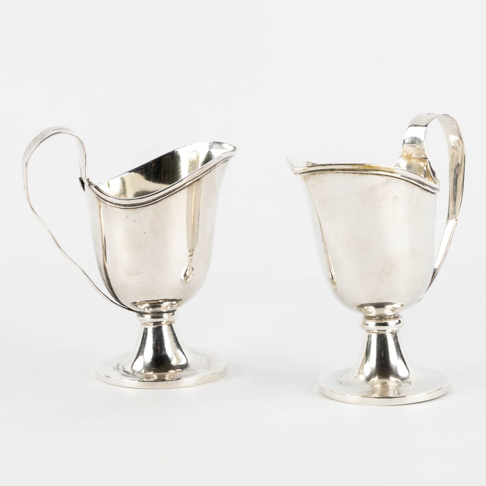 Philippus MYS 1759-1847) A pair of 'Water and Wine Cruets', Vino & Aqua, Silver, Bruges. 19th C. (L: