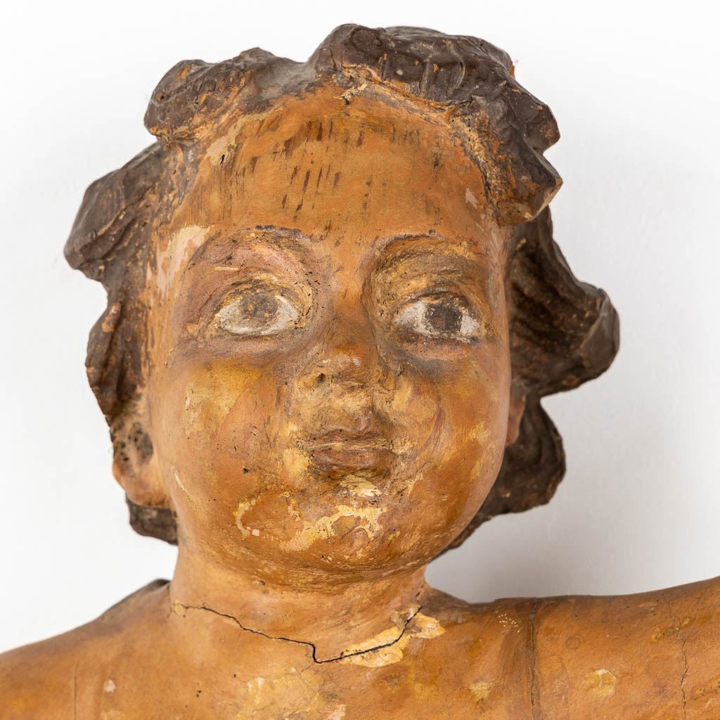 An antique figurine of a putto, sculptured and patinated wood. 18th C. (L:35 x W:34 x H:67 cm) - Image 5 of 12