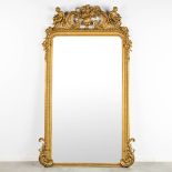 An antique and large mirror, decorated with putti in Louis XV style. Circa 1900. (W:130 x H:225 cm)