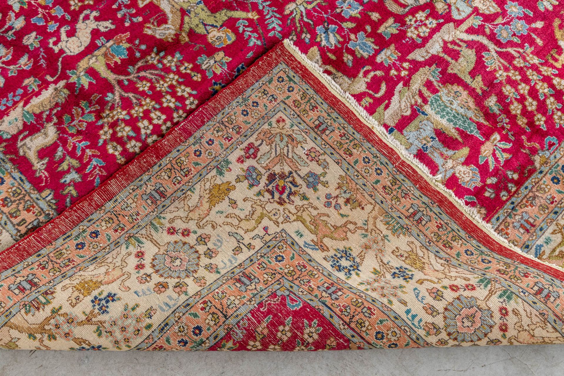 A large Oriental hand made carpet, hunting scènes, Tabriz. (L:329 x W:252 cm) - Image 15 of 16