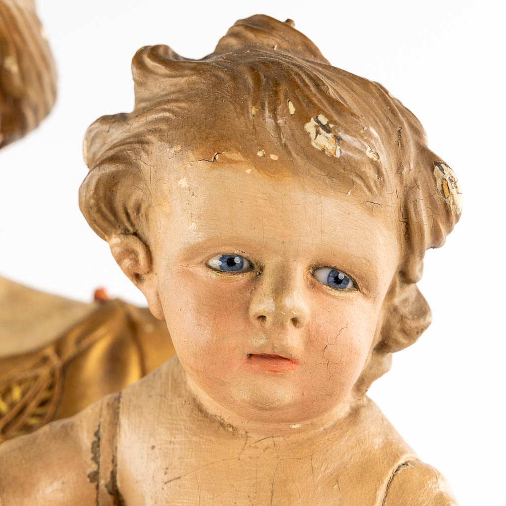 An antique sculptured figurine of a mother with child, wearing an embroidered robe. 19th C. (W:36 x - Image 8 of 15