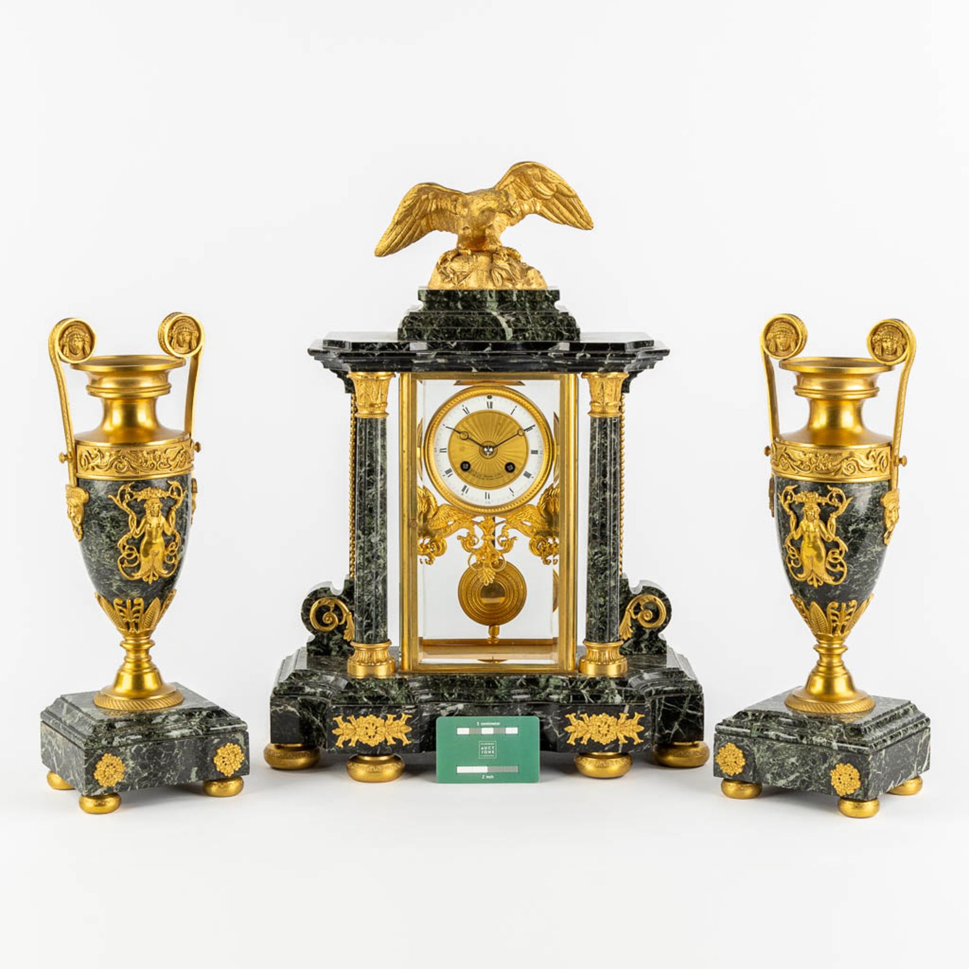 A three-piece mantle garniture clock and urns, gilt bronze on green marble, Empire style. France, 19 - Image 2 of 14