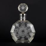 A perfume bottle, etched and mounted with a silver collar, glass. 19th C. (L:8 x W:17 x H:26,5 cm)