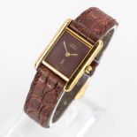 Cartier Tank Quartz, vermeil case with a burgundy dial. (W:2,1 x H:2,8 cm)