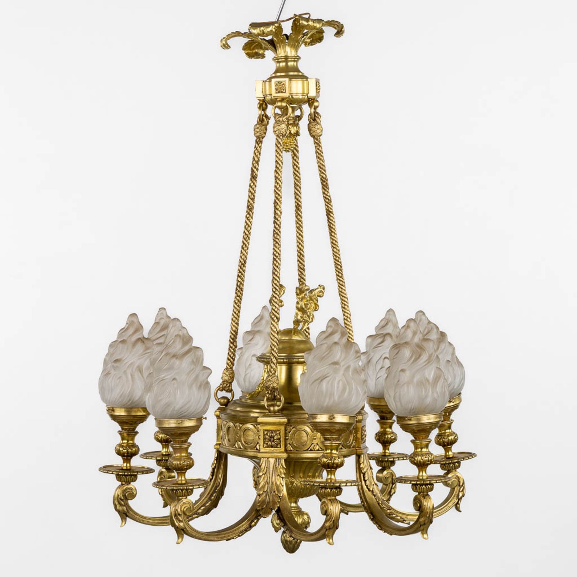 A chandelier, bronze in a Louis XVI style. Gilt bronze. (H:100 x D:72 cm)